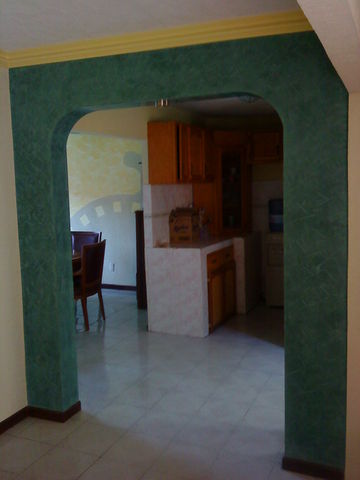 Arco dividiendo comedor y cocina